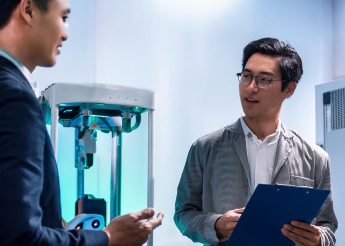 Firefly-A-person-talking-with-another-person-holding-a-clipboard-in-a-laser-lab-81899